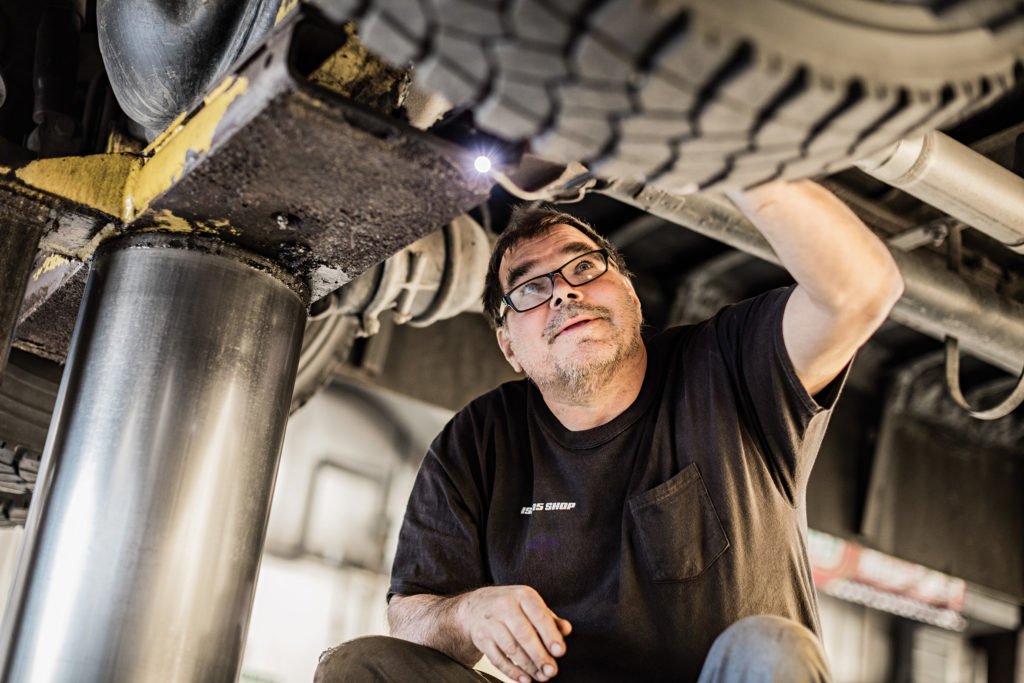 man-working-on-propane-vehicle